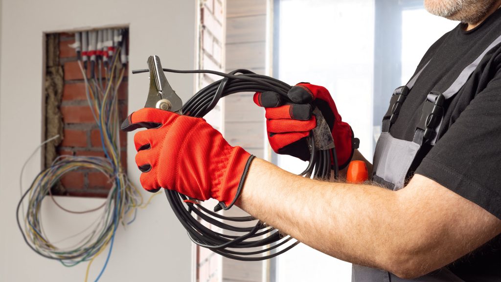 Electrician Wiring An Electrical Panel