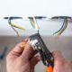 Electrician is upgrading aluminum to copper wiring in a home. This photo shows removing insulation from wires