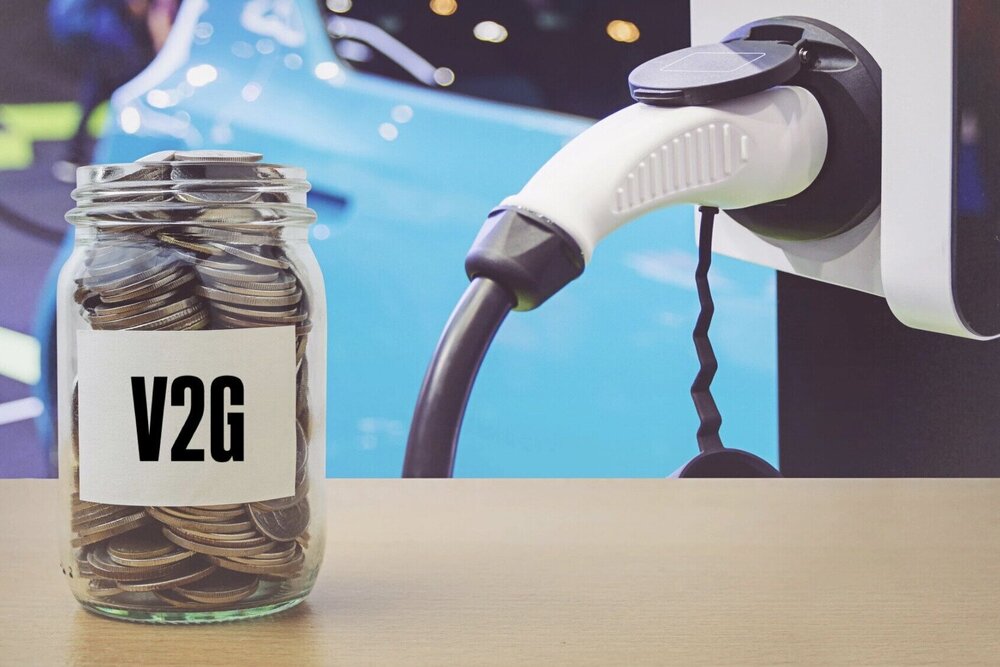 EV being charged and a jar of coins with the label V2G, standing for vehicle-to-grid