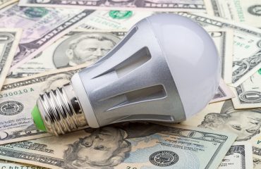 LED electric bulb on dollar.