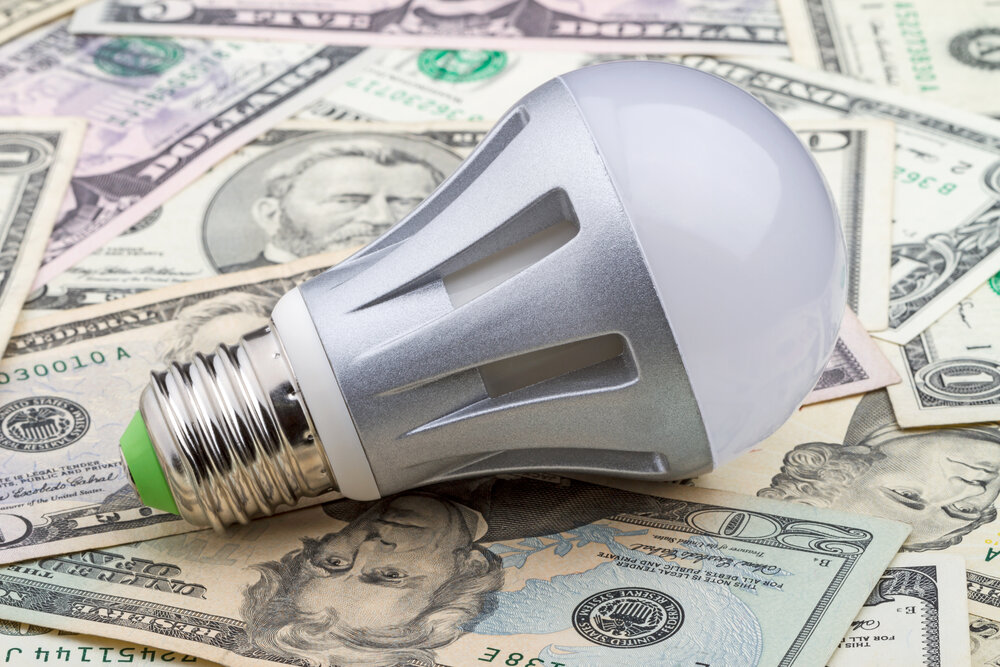 LED electric bulb on dollar.