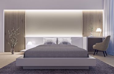 Modern interior design of spacious luxury bedroom with wood slat wall and accent lighting at night