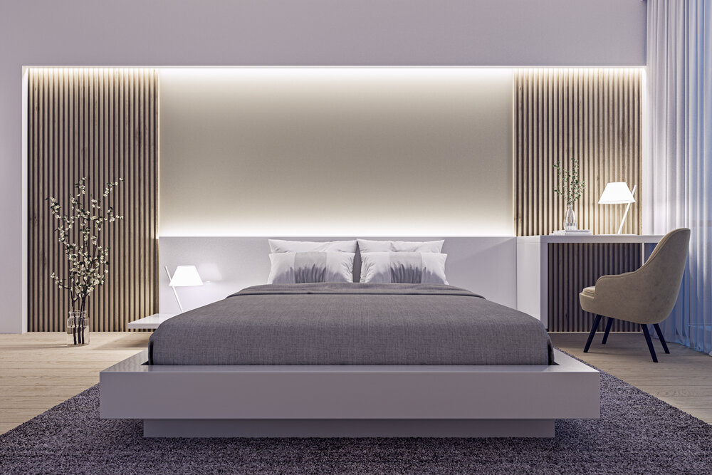 Modern interior design of spacious luxury bedroom with wood slat wall and accent lighting at night